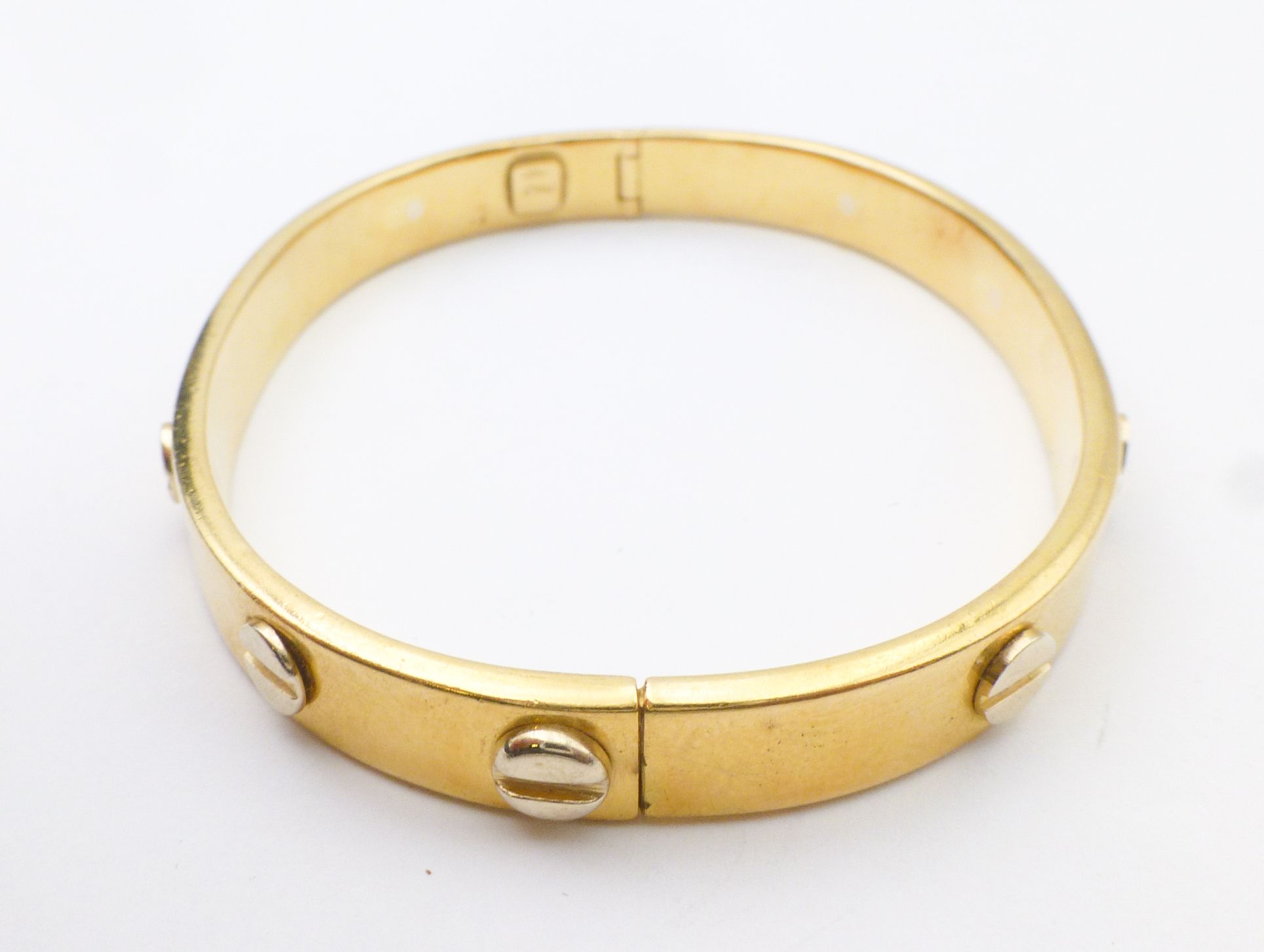 gold bangle with screws
